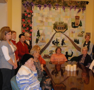 Members of Longwood Garden's volunteer quilting group listen to the rave reviews the quilts have garnered at the 