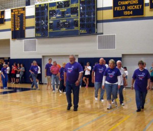 Cancer survivors are applauded by volunteers during the Kennett/Unionville Relay For Life, Friday.