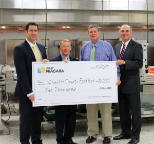 First Niagara’s Allan Burkley (from left) poses with Robert MacNeil, board chairman of the Chester County Food Bank; Larry Welsch, its executive director; and Bob Kane, First Niagara’s eastern Pennsylvania regional president.