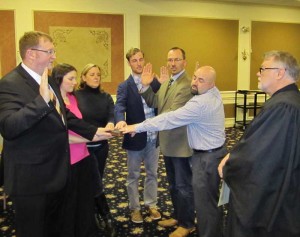 At the Kennett Borough Council meeting Monday night, Judge Dan Maisano (far right) swore in three new and two reelected Council members (from left to right) Patrick Taylor (accompanied by his wife in pink), Lynn Sinclair, Brett Irwin, Dan Maffei, and Geoff Bosley.”