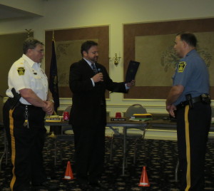 Det. John Trevisan (from right) is recognized for community service by Mayor Matt Fetick and Police Chief Edward A. Zunino.