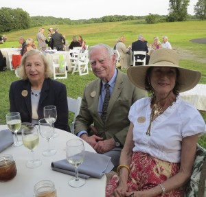 Marquerite (from left) and Gerry Lenfest take a few brief moments to sit on Saturday evening with Penny Watkins, a Natural Lands Trust board member.