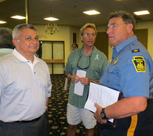 Members of the Kacie's Cause team, Luis Tovar (from left) and Andy Rumford chat with Kennett Square Police Chief Edward  A. Zunino after Monday night's anti-drug presentation.