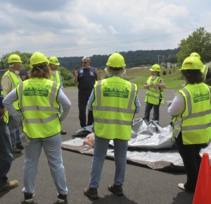 Participants in the county’s new Community Emergency Response Team (CERT) training course receive reminders from instructor Jim Reagan on what to do once a victim has been successfully pulled from the wreckage.