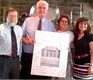 Marty Beech (from left), Mike King, Connie Logan, and Jane Stoutland show of one of the signed prints of the school they each received at their retirement luncheon. 