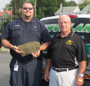 Jim Werner (left), a Uwchlan Ambulance Corps EMT, and Ed Toner, president of the Chester County Fraternal Order of Police, display the shale from the Flight 93 crash site that will be memorialized at the Chester County Public Safety Training Center in South Coatesville.