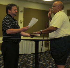 Kennett Square Mayor Matt Fetick (left) swear in Earl T. "Rusty" Jones as an alternate on the borough's Civil Service Commission.