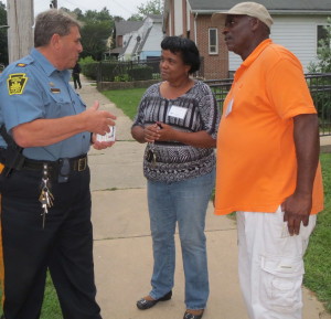 Kennett Square Police Chief Edward A. Zunino (from left) chats with Theresa Bass and Hap London.