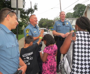 Officer Johnathan Ortiz (from  left), Cpl. William Holdsworth, and Cpl. Christopher Wills enjoy the adulation of their fans.