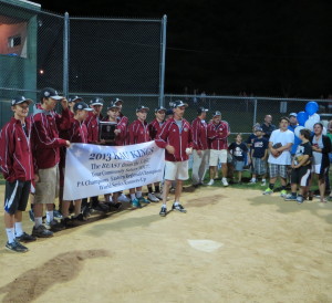 Members of the KAU team – the U.S. Senior League Baseball champs –  line up for an appreciative crowd at their field on Leslie Road in Kennett Square.