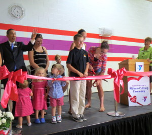 A group of children lined up on Friday to assist with the ribbon-cutting as the Kennett Area YMCA celebrated its grand reopening.