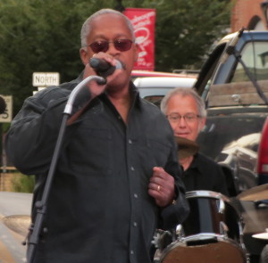 Borough Councilman Leon Spencer, a member of the band Good Foot, urges the crowd to have a "good, good night" at  the post-parade festivities of the Mushroom Festival.