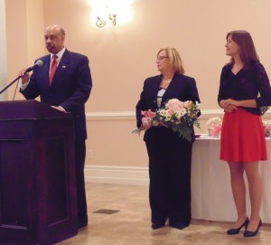 Chester County Commissioner Terence Farrell introduces Empowered Young Woman award-winner Christine Luczka (right). She is joined by Jeannine McCullough, vice chair of the Chester County Women’s Commission.