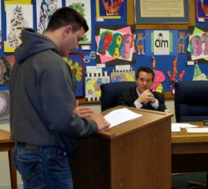 Kennett High Senior Kyle Werner, who is headed to  the Naval Academy, presents the Student Council report at Monday night's board meeting as Mark T. Tracy, assistant to the superintendent, looks on.
