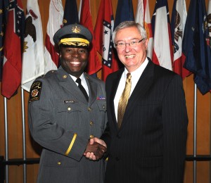 Capt. Maurice L. Tomlinson (left) is congratulated by Pennsylvania State Police Commissioner Frank Noonan.