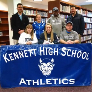 Haeli McCabe (seated middle) surrounded by her parents, Vicky Wilson (left) and Jeff McCabe (right) along with (standing left to right) physical therapist Dan Jensen, KHS head field hockey coach Meghan Shumway, Club Field Hockey Coach Brian Hope and physical therapist Marty Zackroff