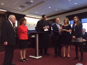 Chester County Court of Common Pleas President Judge James P. MacElree II (left) administers the Oath of Office for County Commissioner to Michelle Kichline (second right). Also pictured are Michelle’s husband, Michael Kichline, and her daughter Amanda (right).