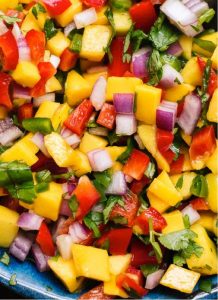Grilled fruits combined with vegetables add smokiness and sweetness to summer salsas.