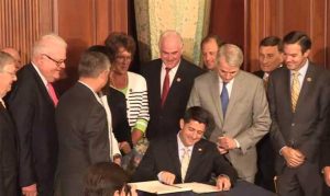 Congressman Meehan looks on as Speaker Paul Ryan signs the Comprehensive Addiction and Recovery Act to send it to the President’s desk on July 14, 2016