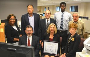 (Front row, left to right) Glenn Angstadt, Chester County Chief Information Officer; Chester County Clerk of Courts Robin Marcello; and Deputy Clerk of Courts Alexis Barsamian.  (Back row, left to right) Nadine Holmes, DCIS Lead Business Analyst; Nat Pitti, DCIS Project Manager; Peter Cooper, DCIS Production Support Analyst; Ian Scott, General Clerk and Daniel Kerrigan, Lead Court Clerk, from the Clerk of Courts Office.